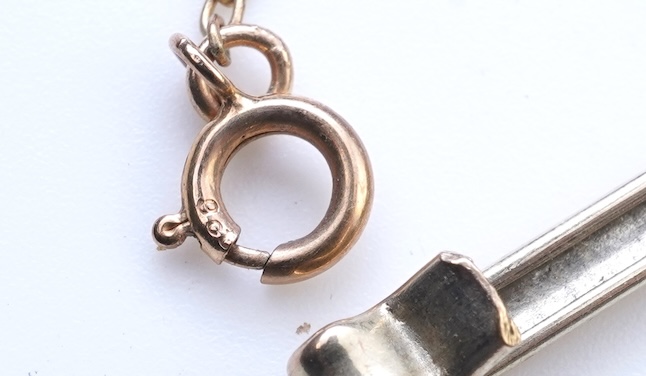 An opal triplet bracelet and pair of earrings, comprising: a gold bracelet set with opal triplets, length 18cm; and a pair of studs set with opal doublets, mounted in gold, length 0.8cm each, post fittings, stamped 585,
